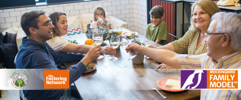 Children and adults eating at a table