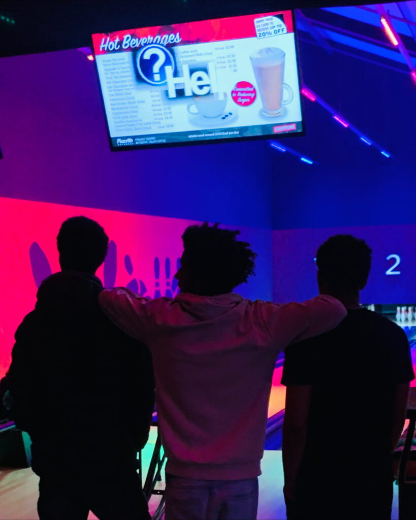 Young people bowling